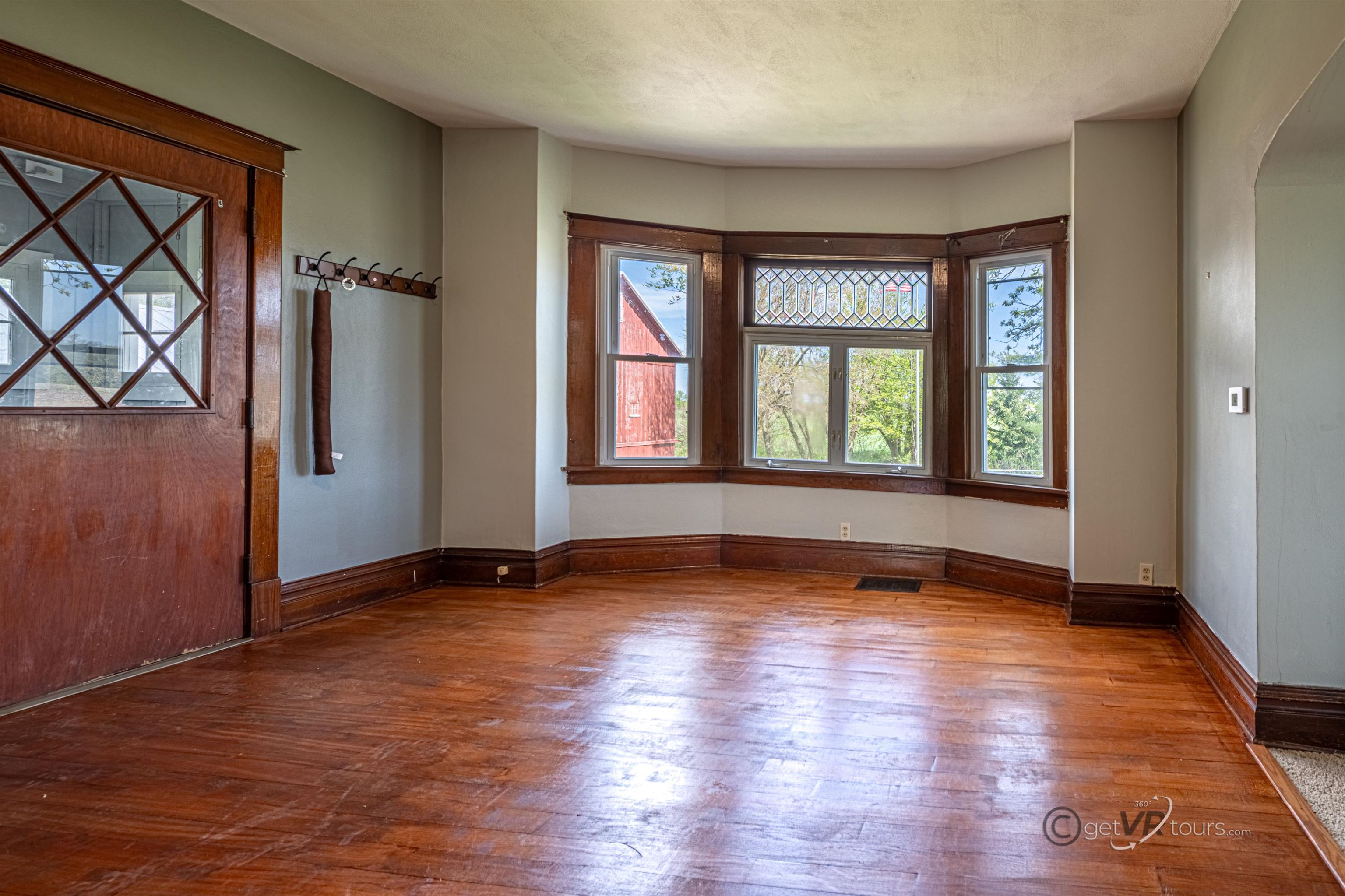 6844 Highway 20 Freeport, IL 61032 - Photo 7 of 31 an empty room with wooden floor and windows