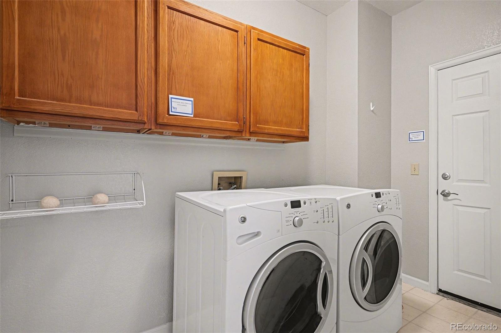 12271 West Chenango Drive Morrison, CO 80465 - Photo 14 of 37 a utility room with dryer and washer