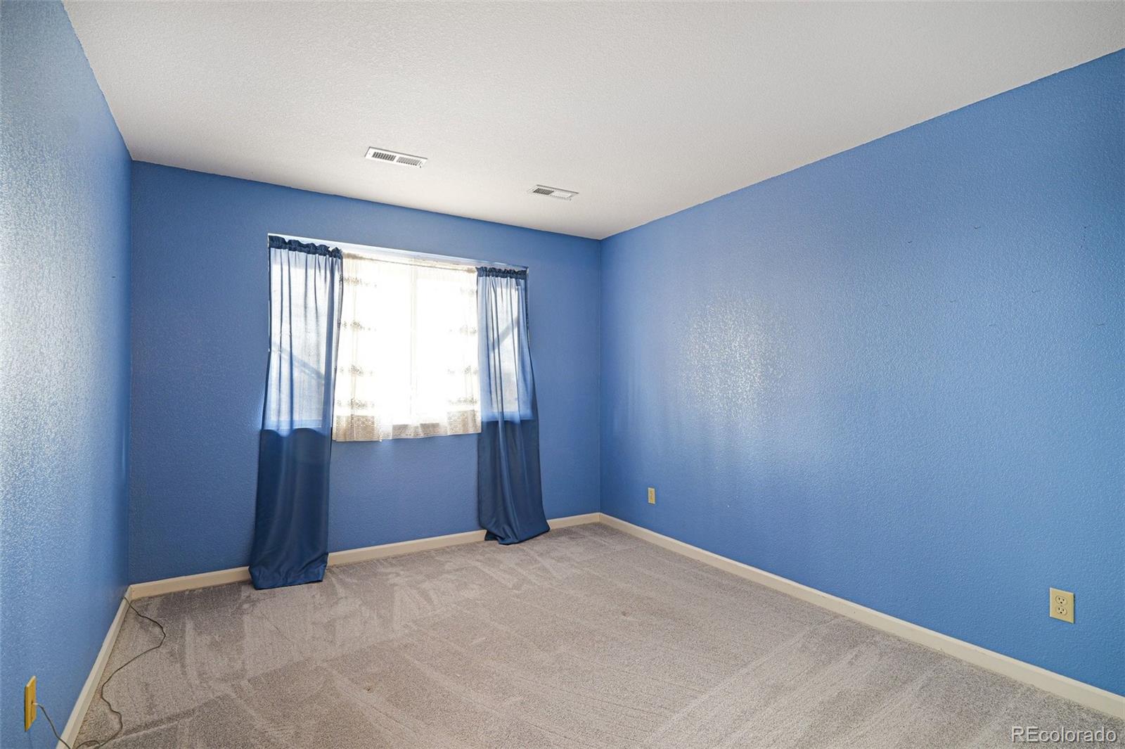 12271 West Chenango Drive Morrison, CO 80465 - Photo 17 of 37 a bedroom with a bed and a window