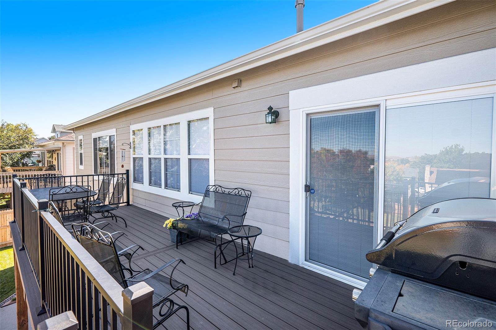 12271 West Chenango Drive Morrison, CO 80465 - Photo 19 of 37 a balcony with furniture and wooden floor