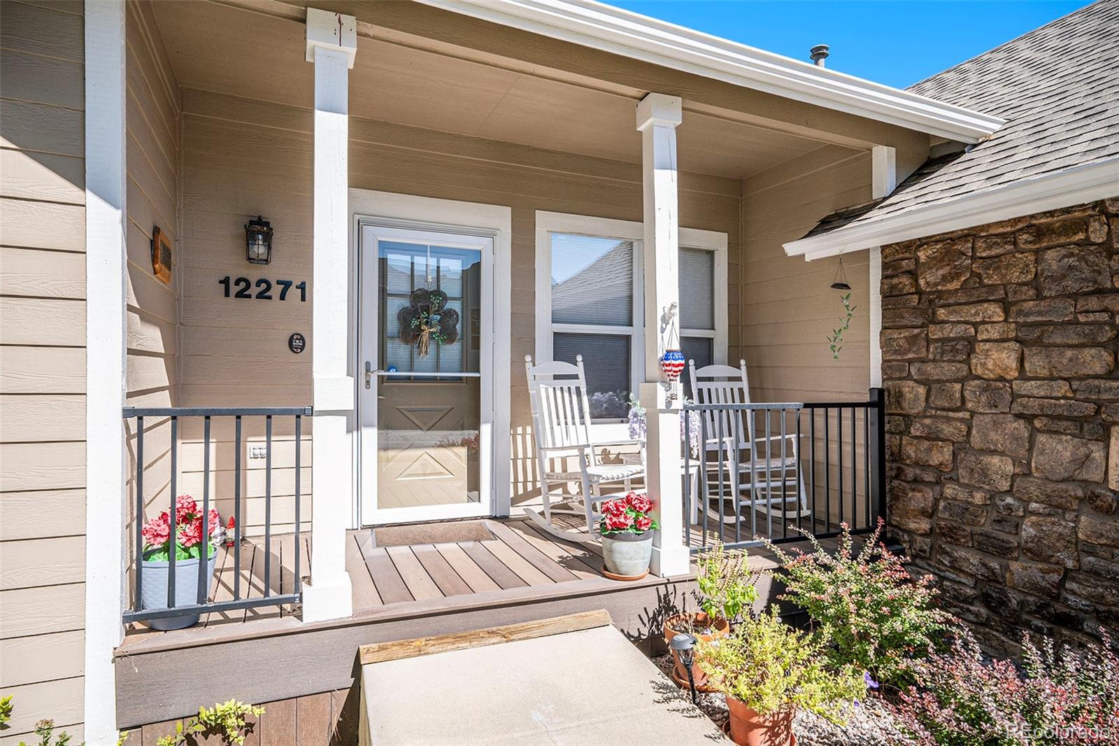 12271 West Chenango Drive Morrison, CO 80465 - Photo 2 of 37 a view of outdoor space and garden