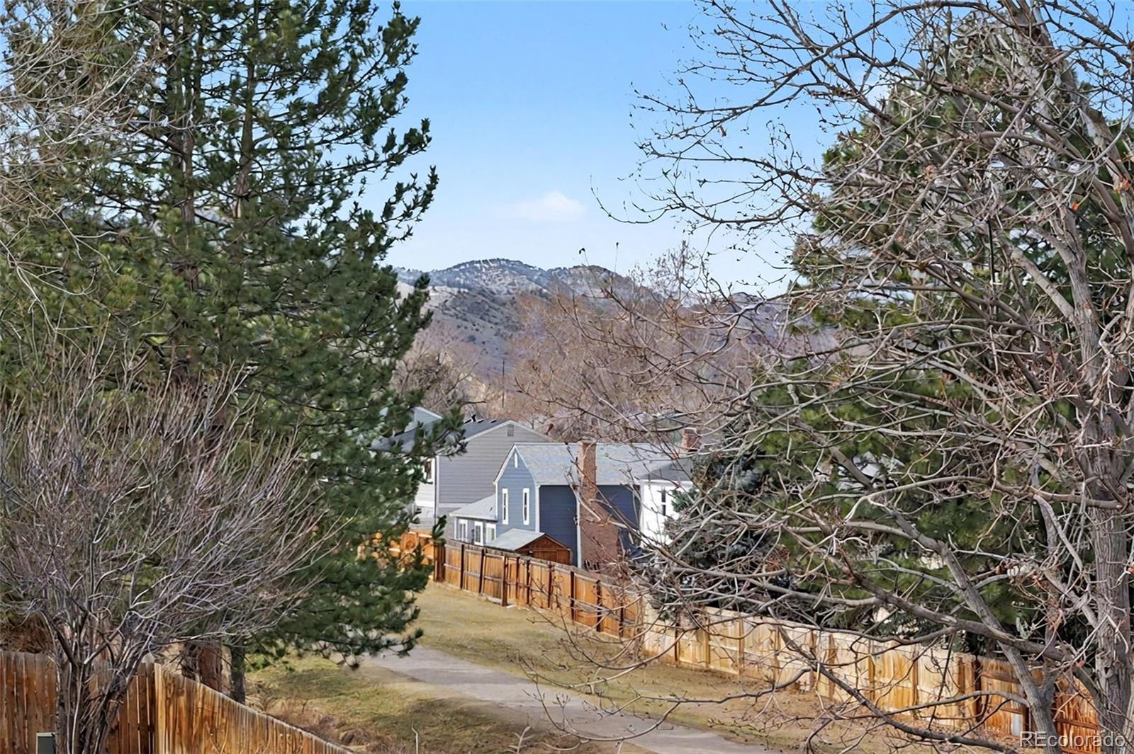 12271 West Chenango Drive Morrison, CO 80465 - Photo 22 of 37 a view of a house with a tree