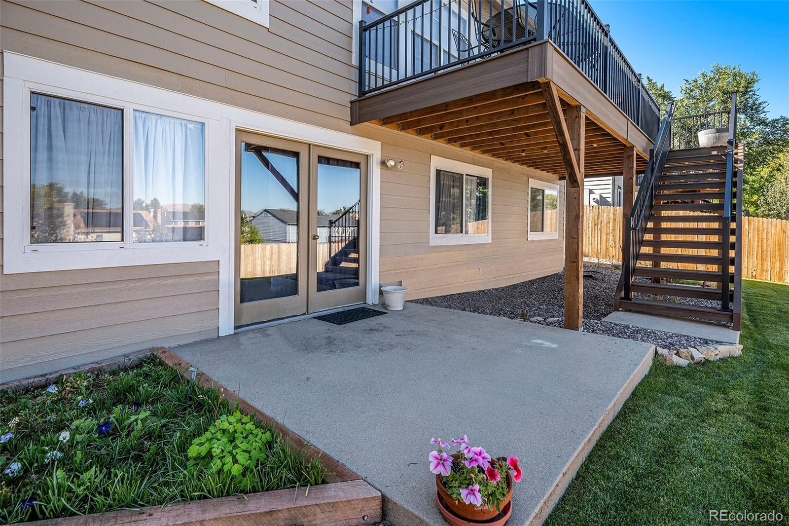 12271 West Chenango Drive Morrison, CO 80465 - Photo 24 of 37 a view of house with backyard and garden