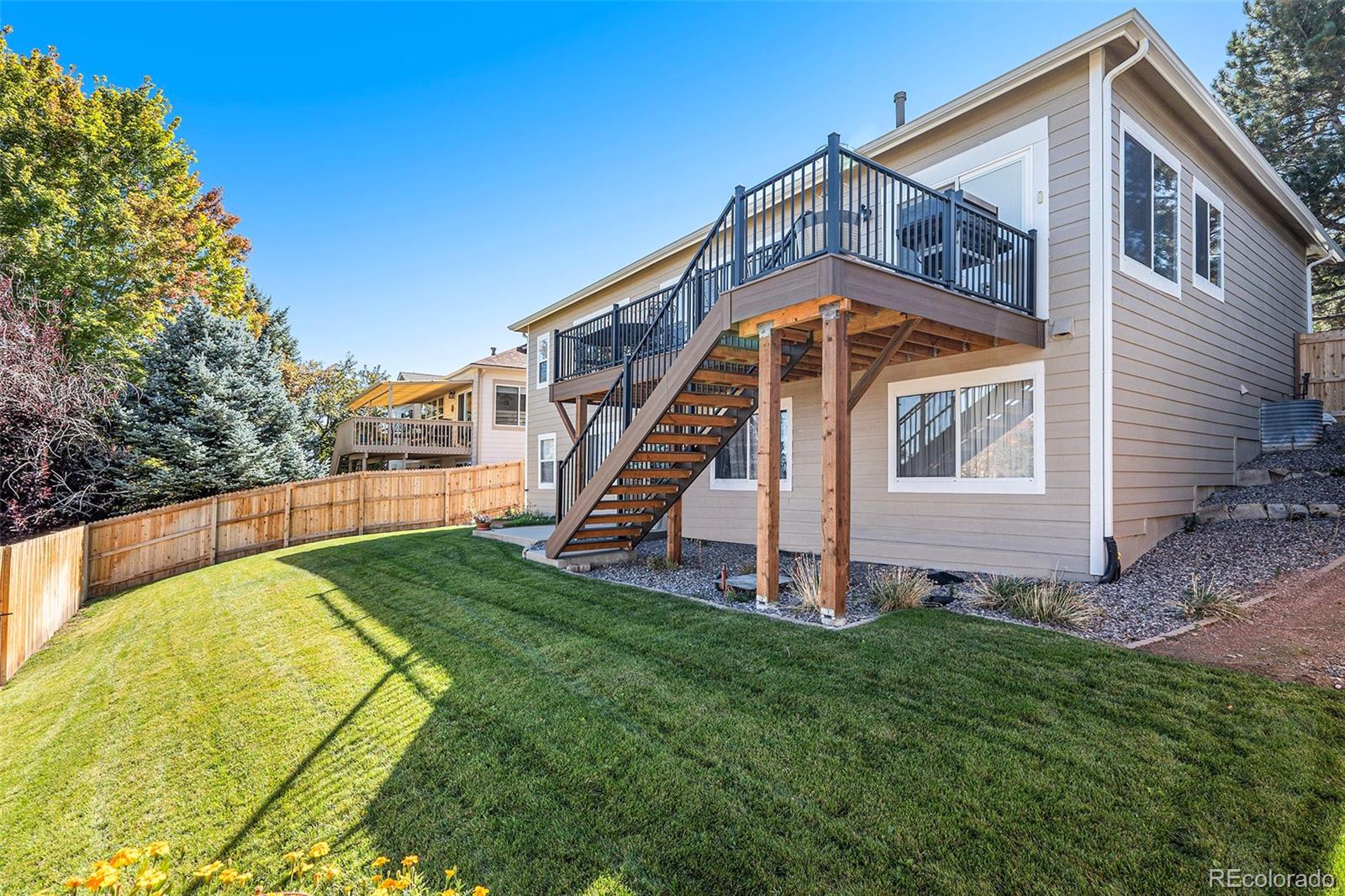 12271 West Chenango Drive Morrison, CO 80465 - Photo 26 of 37 a view of a house with a yard