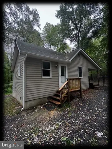 a house view with a backyard space