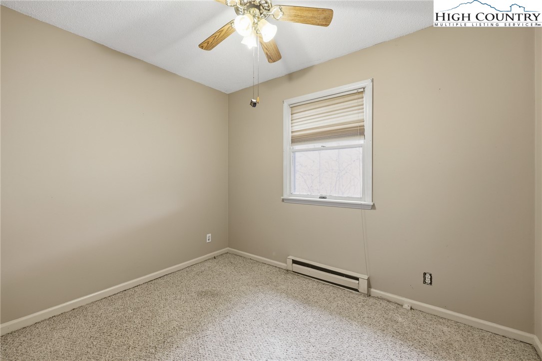 2202 Old 16 Highway Jefferson, NC 28640 - Photo 13 of 15 an empty room with a window