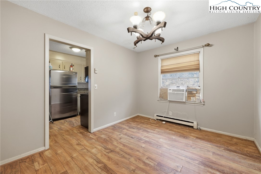 2202 Old 16 Highway Jefferson, NC 28640 - Photo 4 of 15 a view of a room with a wooden floor