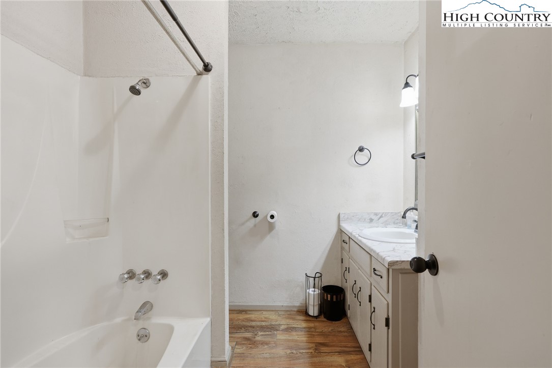 2202 Old 16 Highway Jefferson, NC 28640 - Photo 6 of 15 a bathroom with a sink and a tub