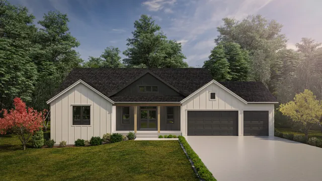 a front view of a house with a yard and trees