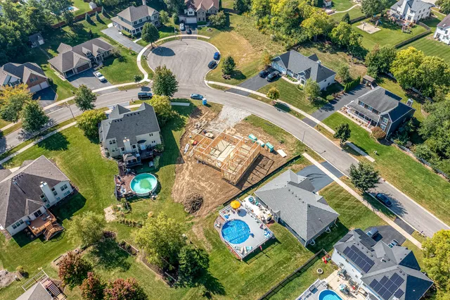 an aerial view of residential building and ocean