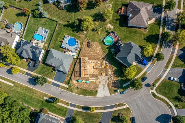 an aerial view of residential houses with outdoor space