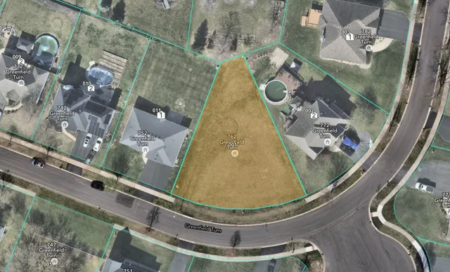 a picture of a room with a white wall and refrigerator