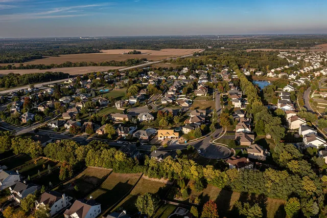 an aerial view of a house with a swimming pool