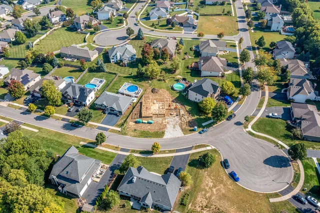 an aerial view of residential houses with outdoor space