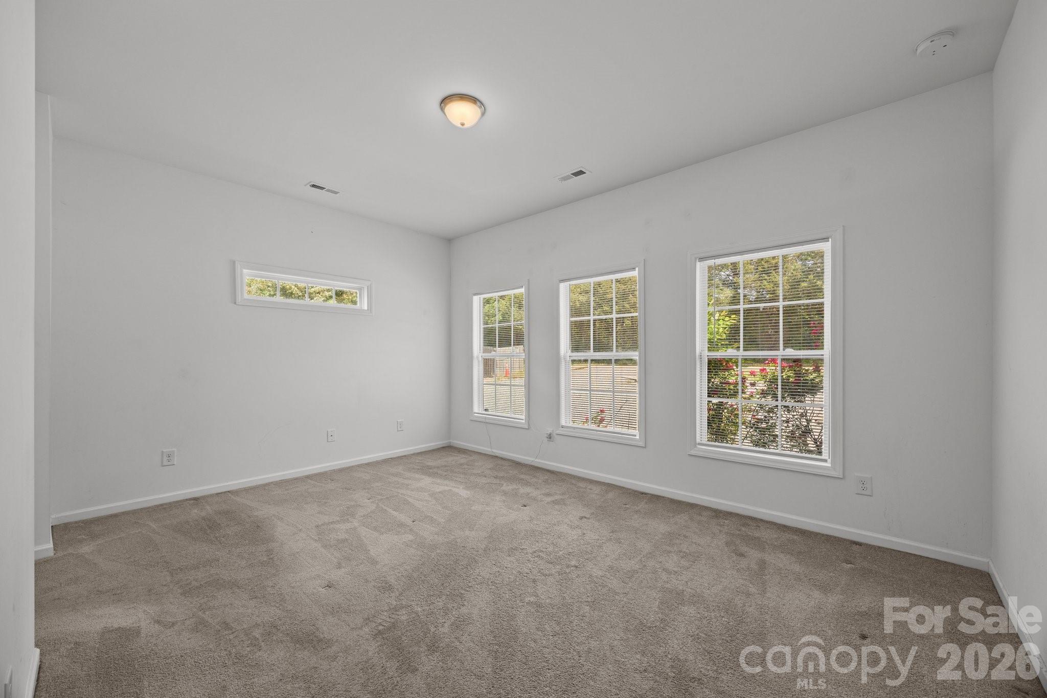 14532 East Rocky River Road Davidson, NC 28036 - Photo 22 of 32 an empty room with windows