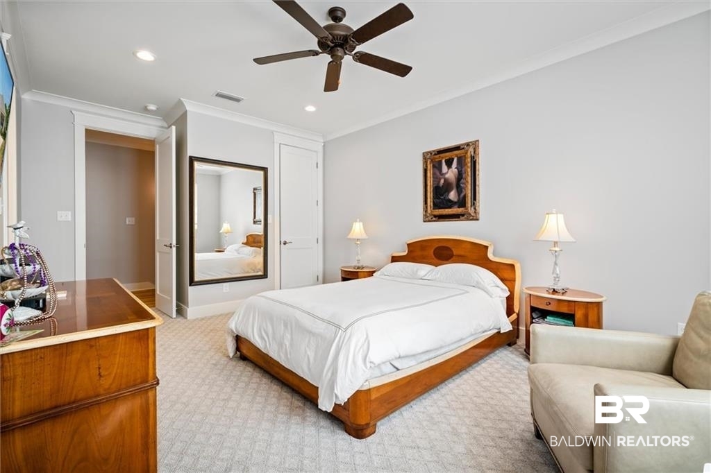 707 Cardamel Court Fairhope, AL 36532 - Photo 33 of 40 Bedroom featuring ornamental molding, carpet floors, and ceiling fan