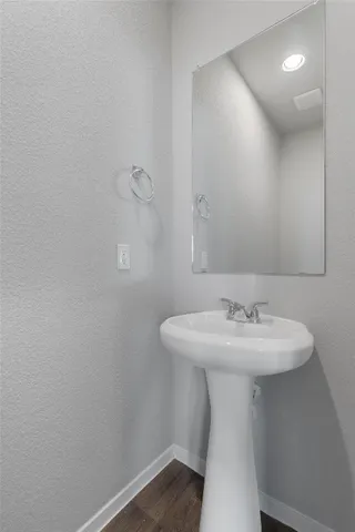 a bathroom with a sink a mirror and vanity