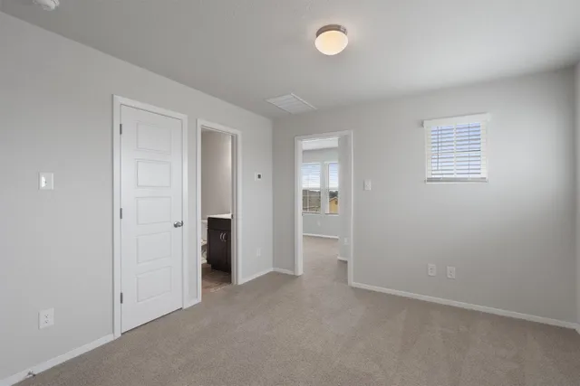 an empty room with closet area