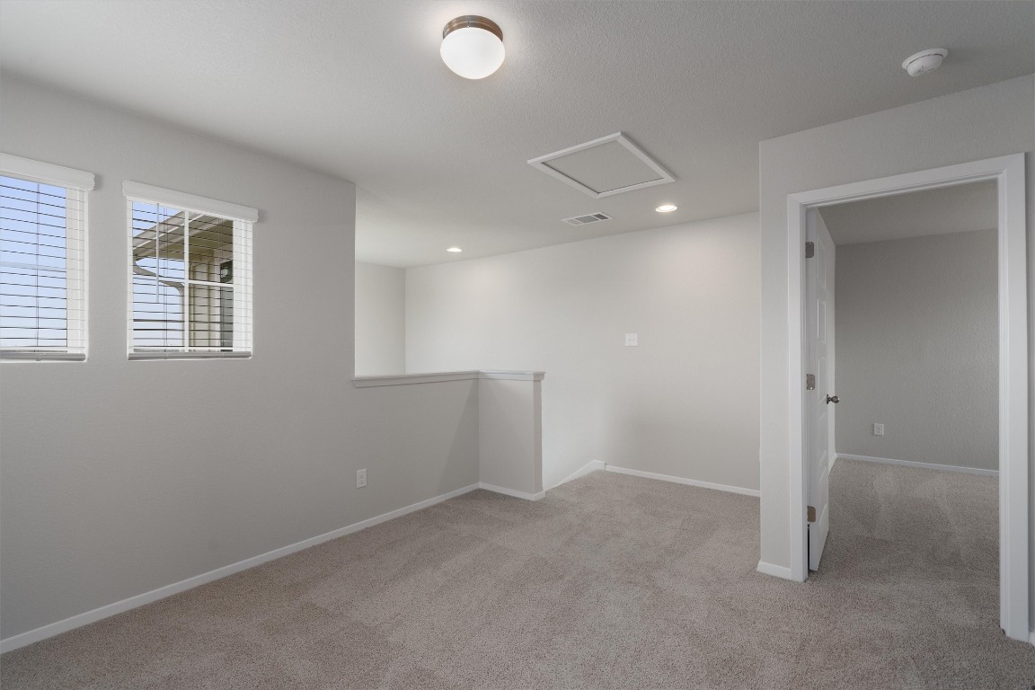 101 Keltic Drive Kyle, TX 78640 - Photo 20 of 29 an empty room with windows and closet