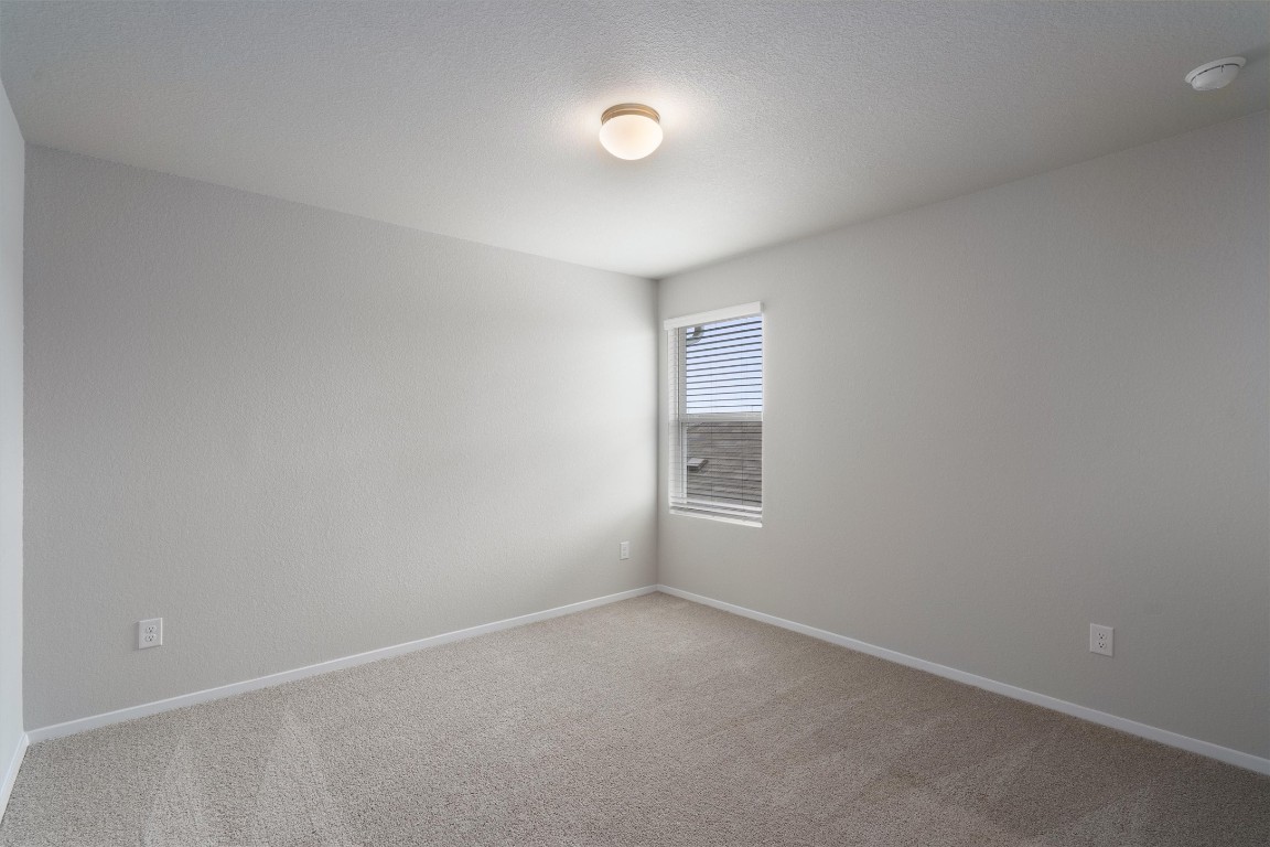 101 Keltic Drive Kyle, TX 78640 - Photo 22 of 29 a view of an empty room with a window