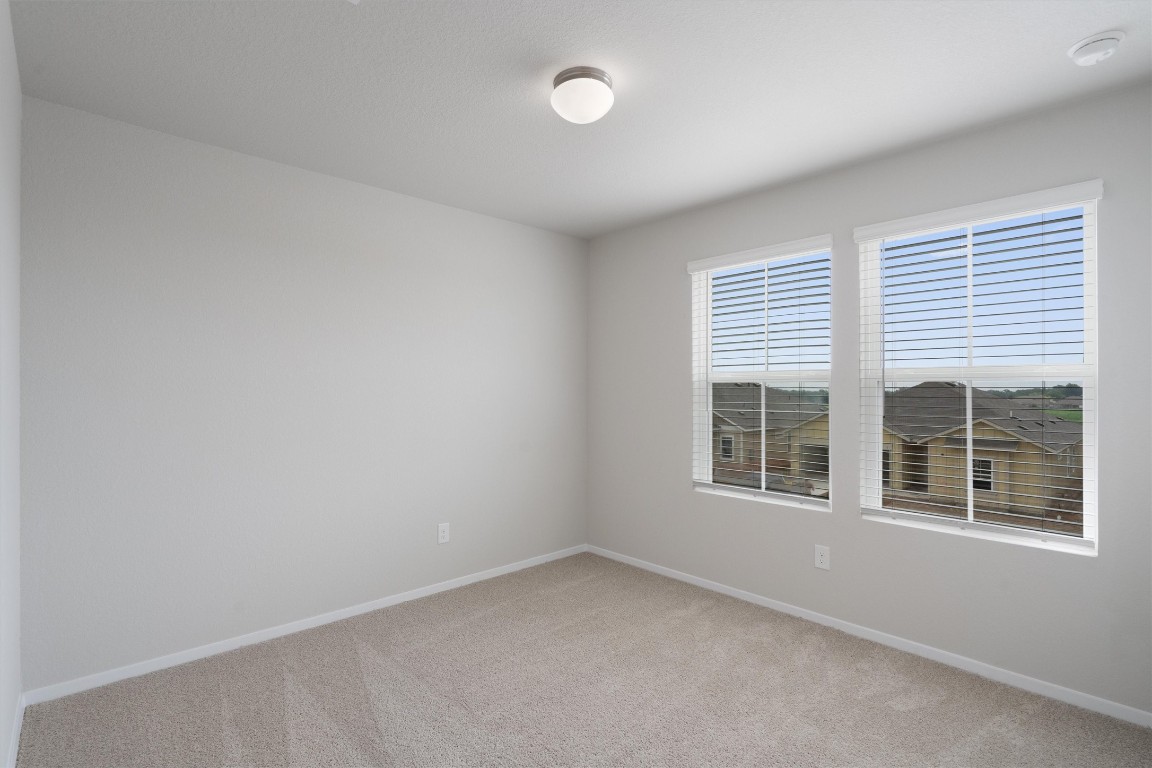 101 Keltic Drive Kyle, TX 78640 - Photo 24 of 29 an empty room with a window
