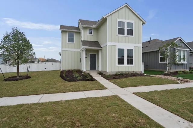 a view of a yard in front of a house