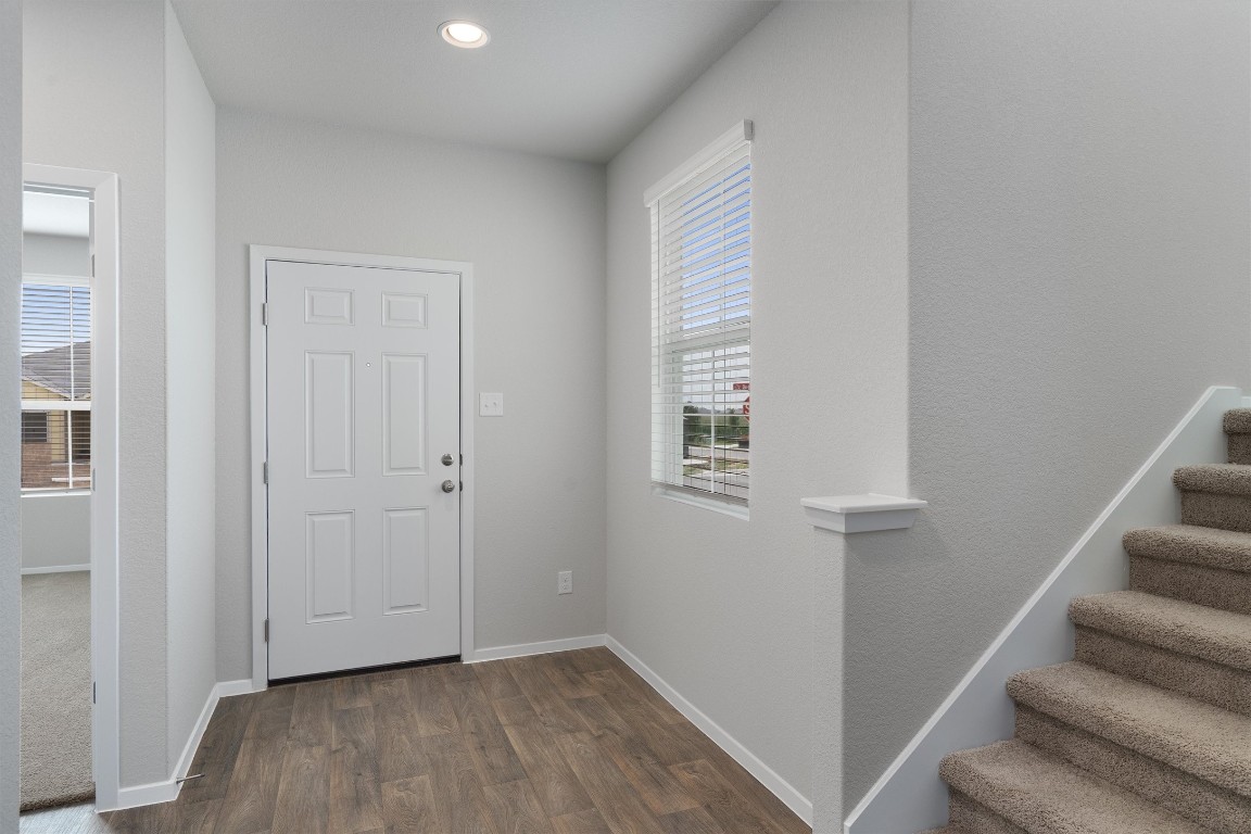 101 Keltic Drive Kyle, TX 78640 - Photo 5 of 29 a view of entryway with stairs and wooden floor