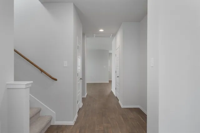a view of a hallway with staircase