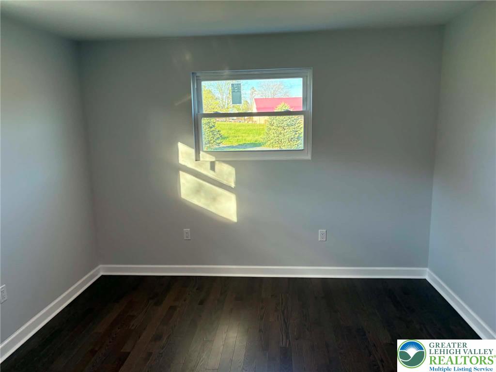 3957 Mountain Road Slatington, PA 18080 - Photo 25 of 33 a view of an empty room with wooden floor and a window