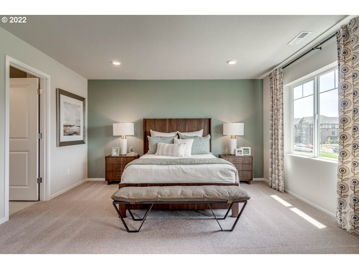 2699 26th Loop Springfield, OR 97477 - Photo 12 of 13 a bedroom with a bed and wooden floor