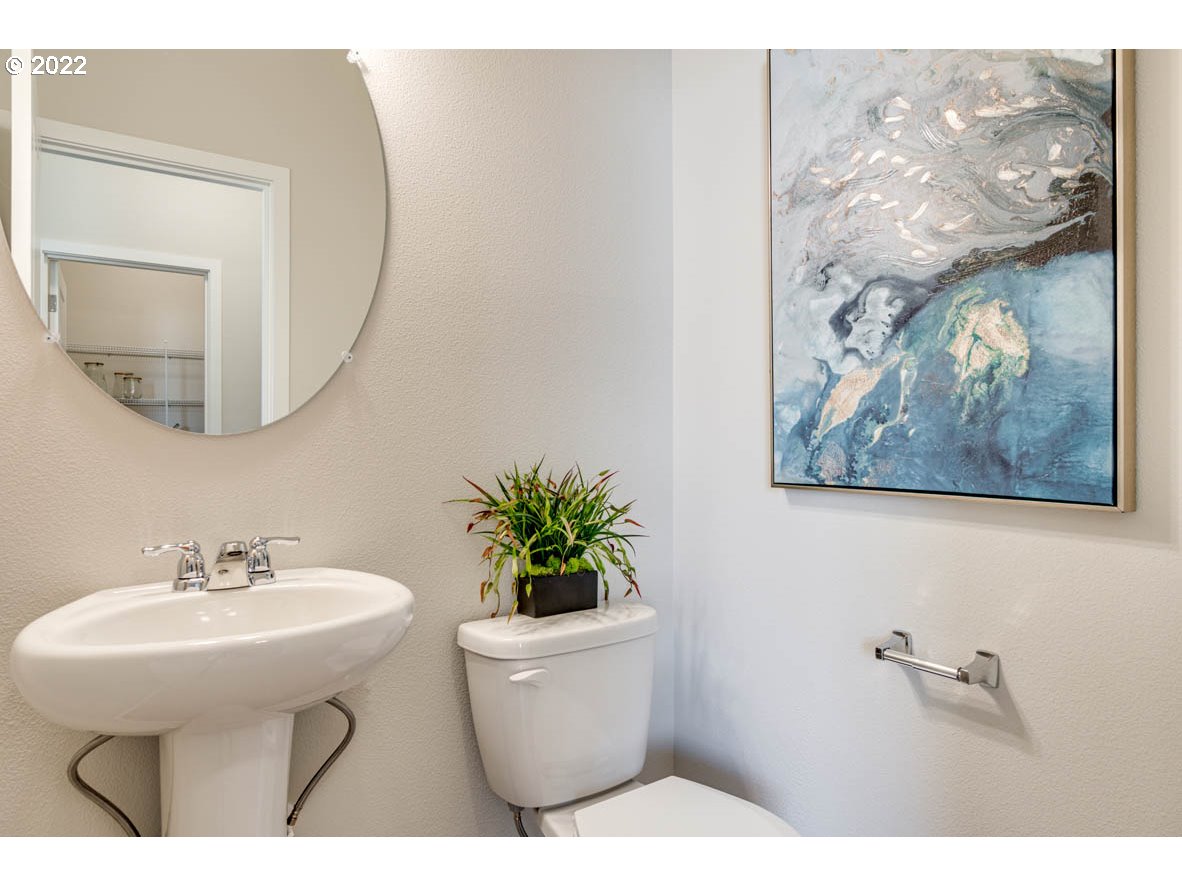 2699 26th Loop Springfield, OR 97477 - Photo 4 of 13 a bathroom with a sink mirror and vanity