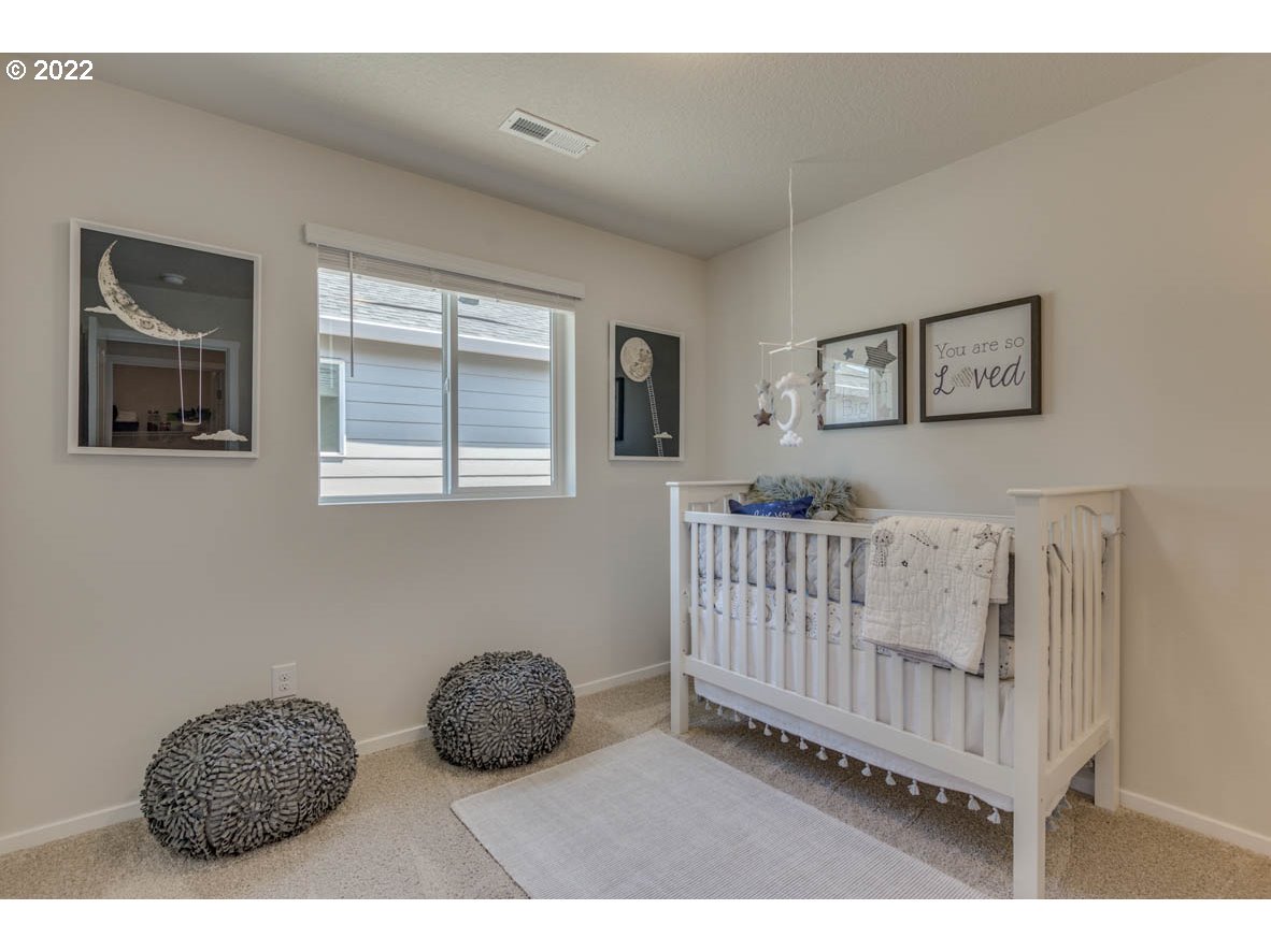 2699 26th Loop Springfield, OR 97477 - Photo 6 of 13 a bedroom with furniture and a window