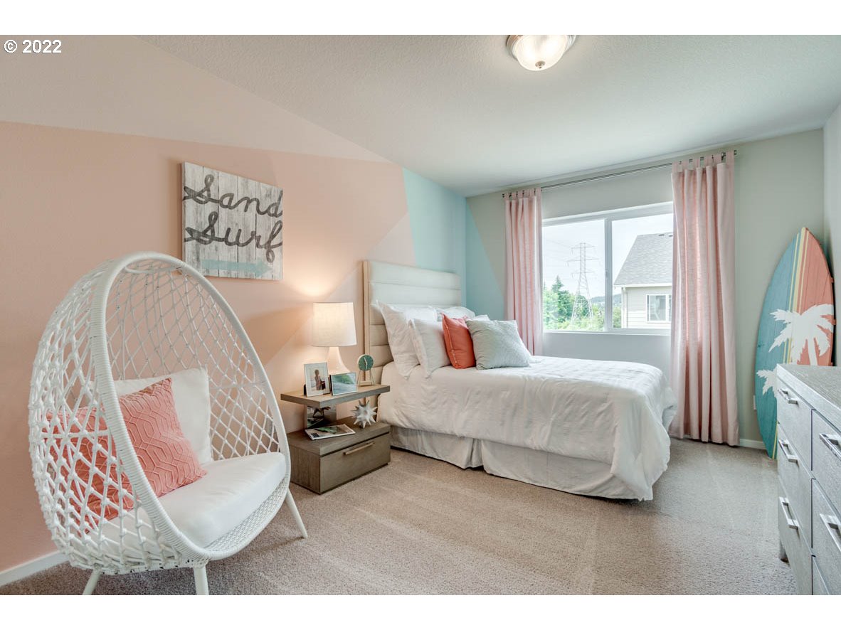 2699 26th Loop Springfield, OR 97477 - Photo 9 of 13 a bedroom with a bed a couch and a large window