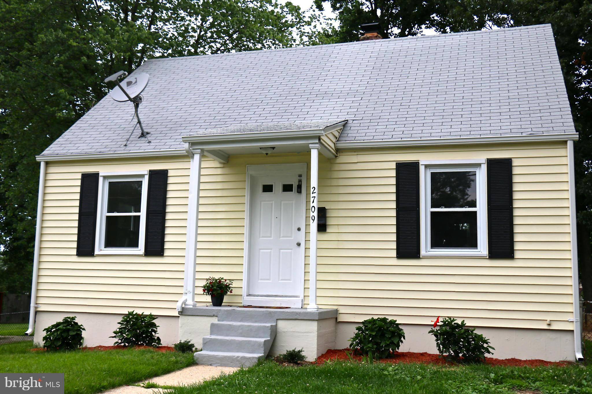 2709 Newton Street Silver Spring, MD 20902 - Photo 1 of 25 a front view of a house with a yard