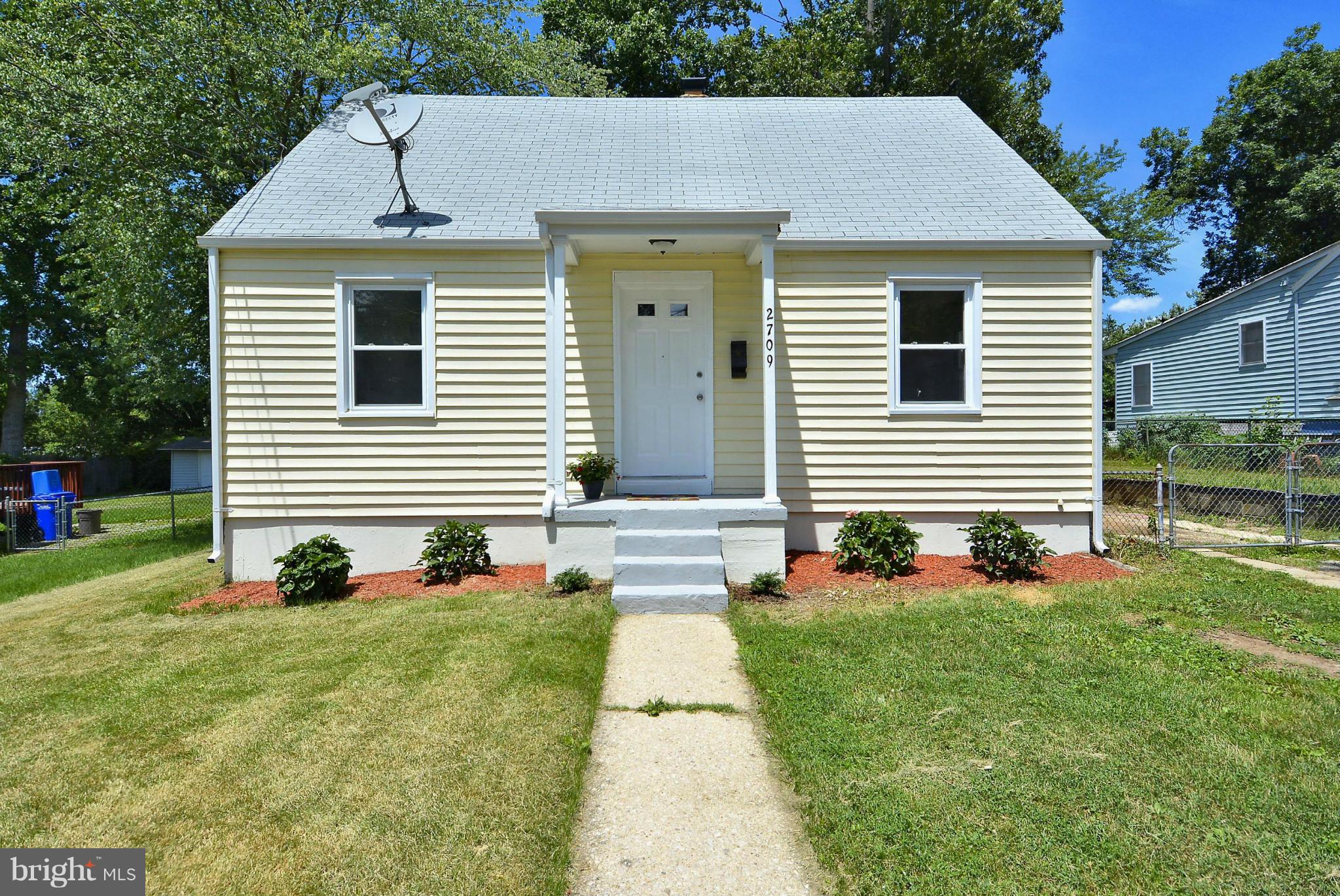 2709 Newton Street Silver Spring, MD 20902 - Photo 2 of 25 a front view of a house with a yard