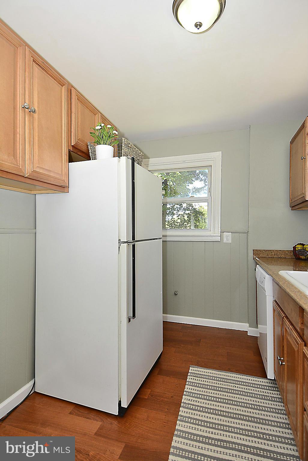2709 Newton Street Silver Spring, MD 20902 - Photo 11 of 25 a kitchen with a refrigerator and wooden floor