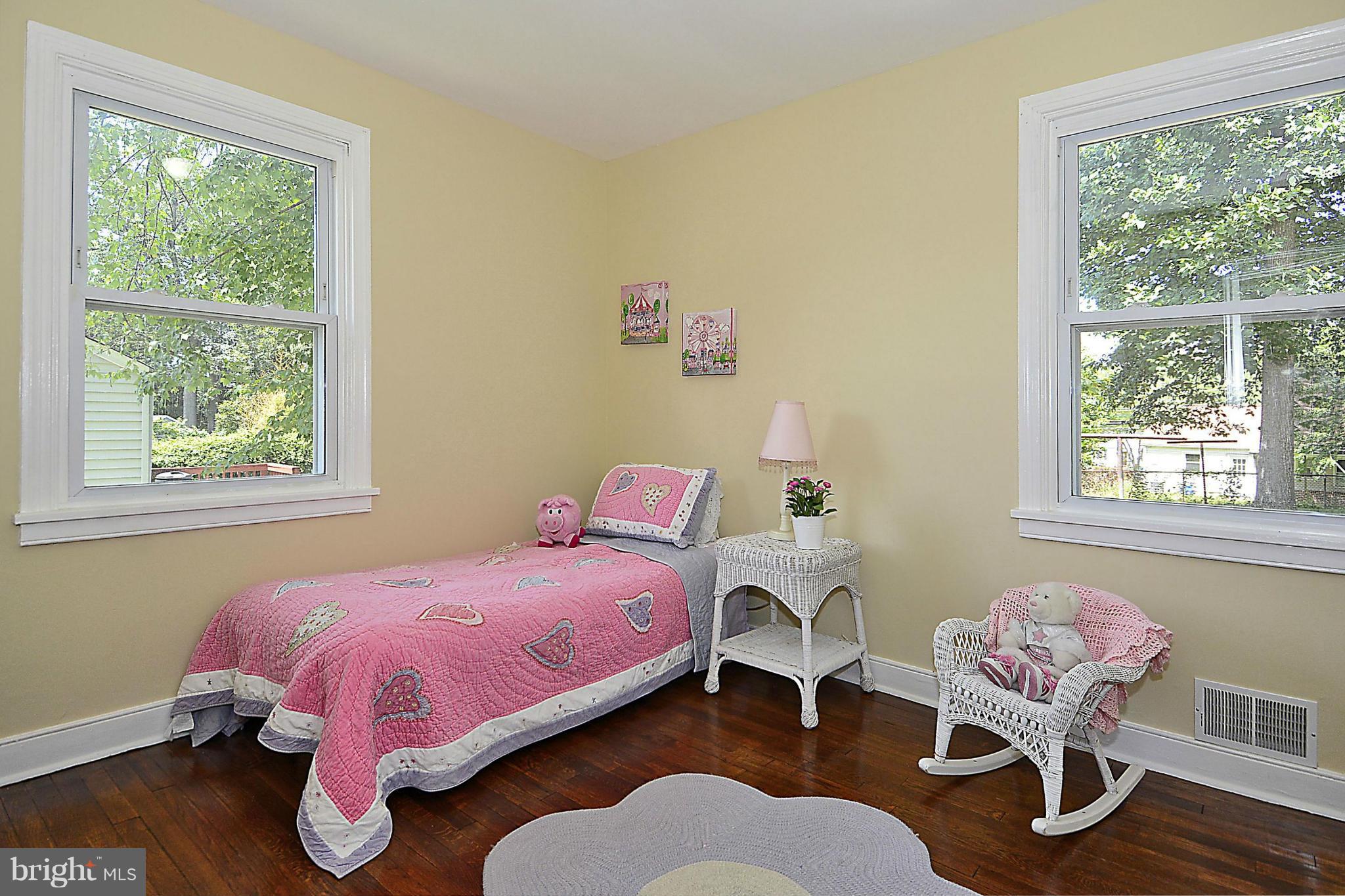 2709 Newton Street Silver Spring, MD 20902 - Photo 16 of 25 a bedroom with a bed and wooden floor