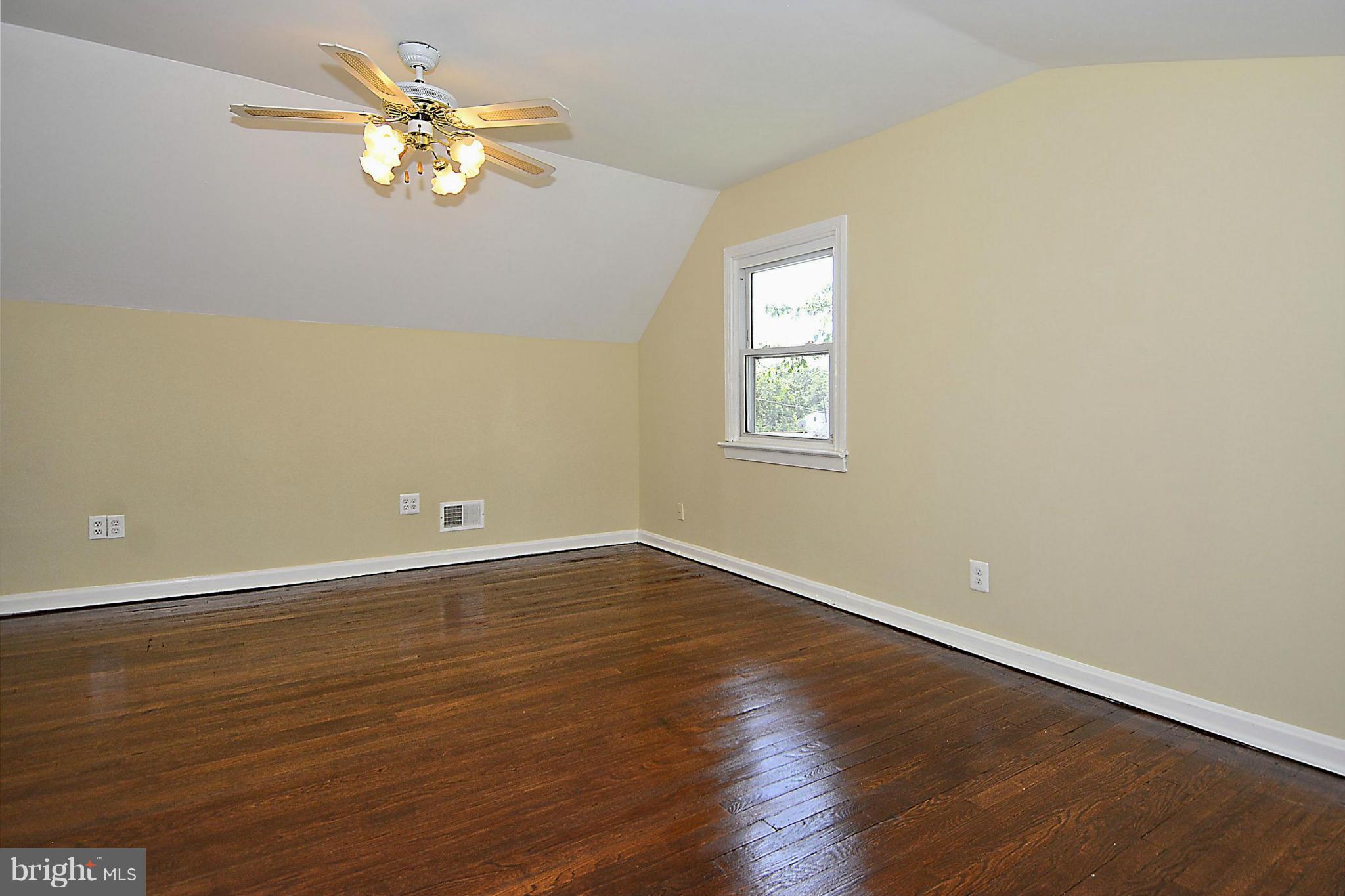 2709 Newton Street Silver Spring, MD 20902 - Photo 19 of 25 an empty room with wooden floor and window