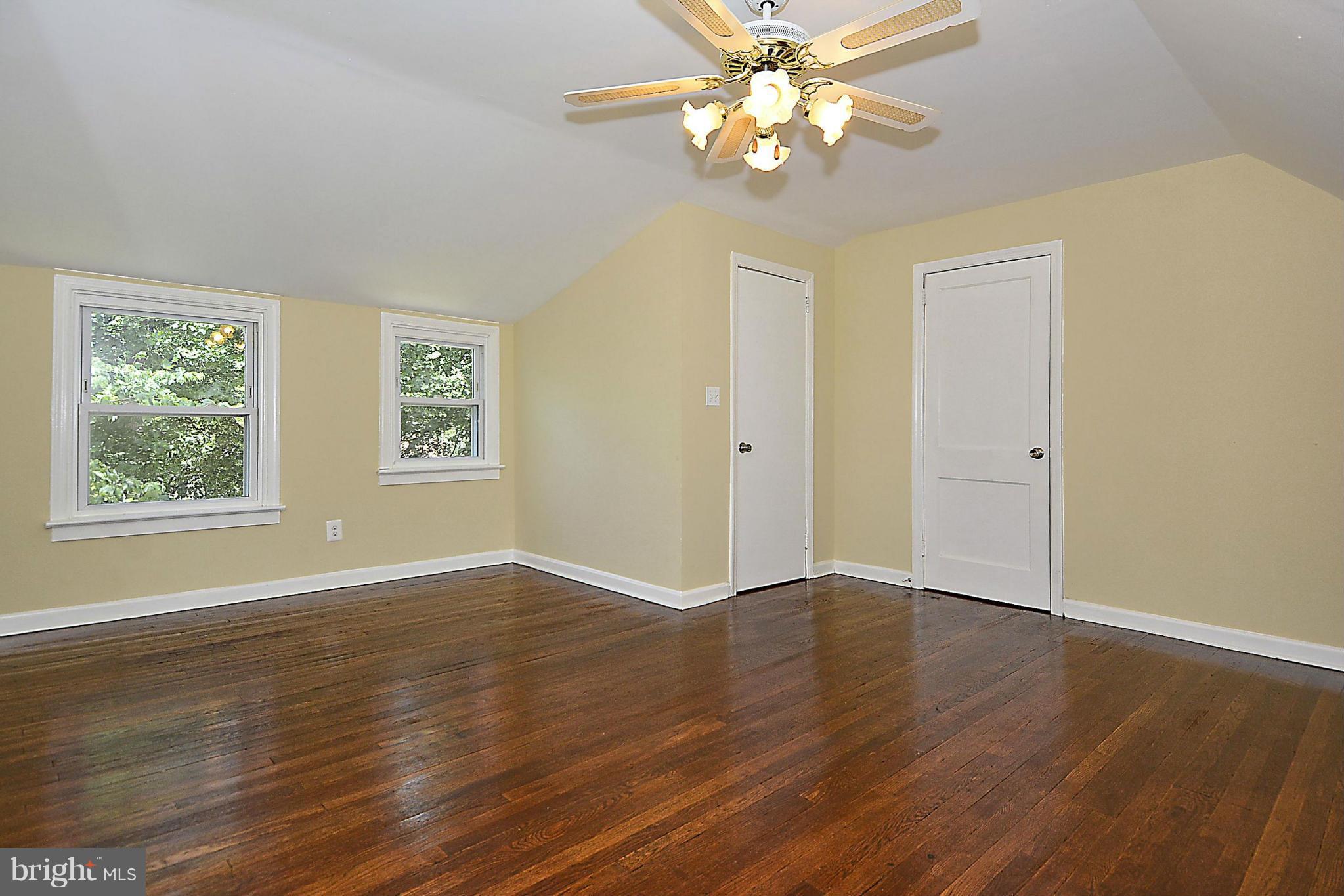 2709 Newton Street Silver Spring, MD 20902 - Photo 20 of 25 a view of an empty room with wooden floor and a window