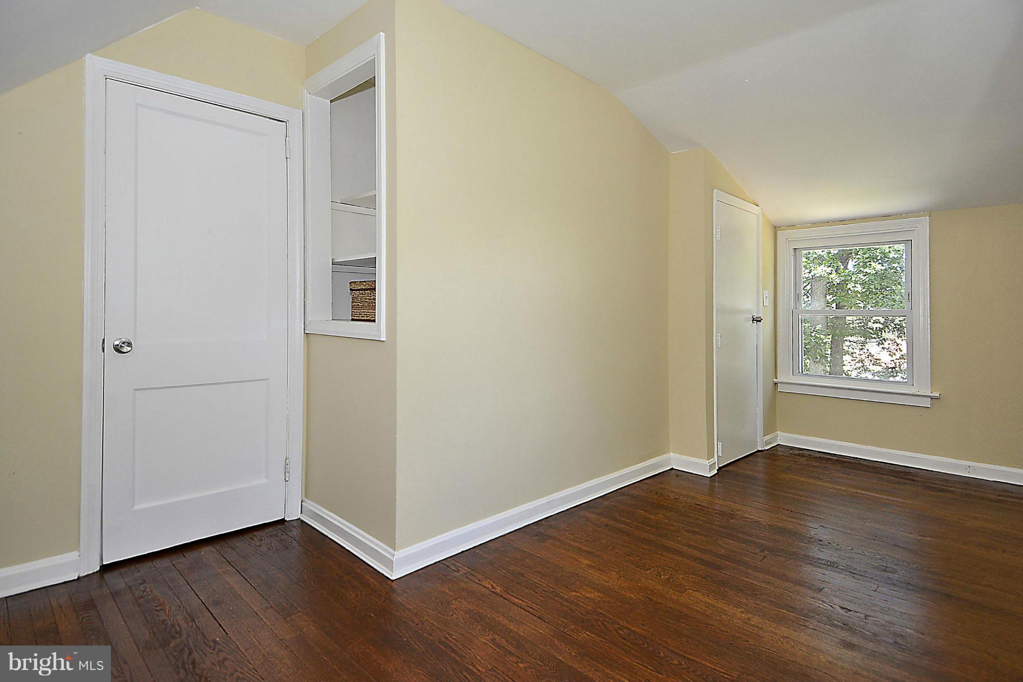 2709 Newton Street Silver Spring, MD 20902 - Photo 21 of 25 an empty room with wooden floor and windows