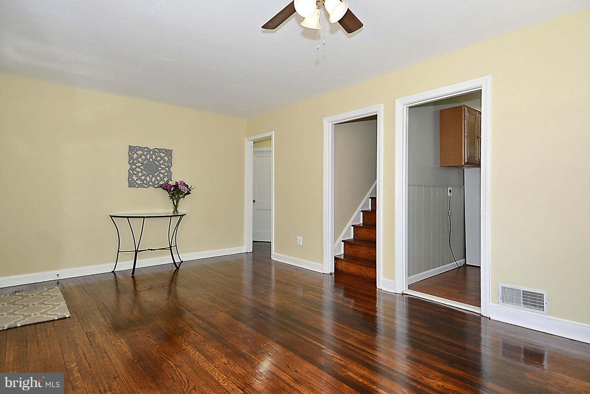 2709 Newton Street Silver Spring, MD 20902 - Photo 9 of 25 a view of a hallway with wooden floor and workspace