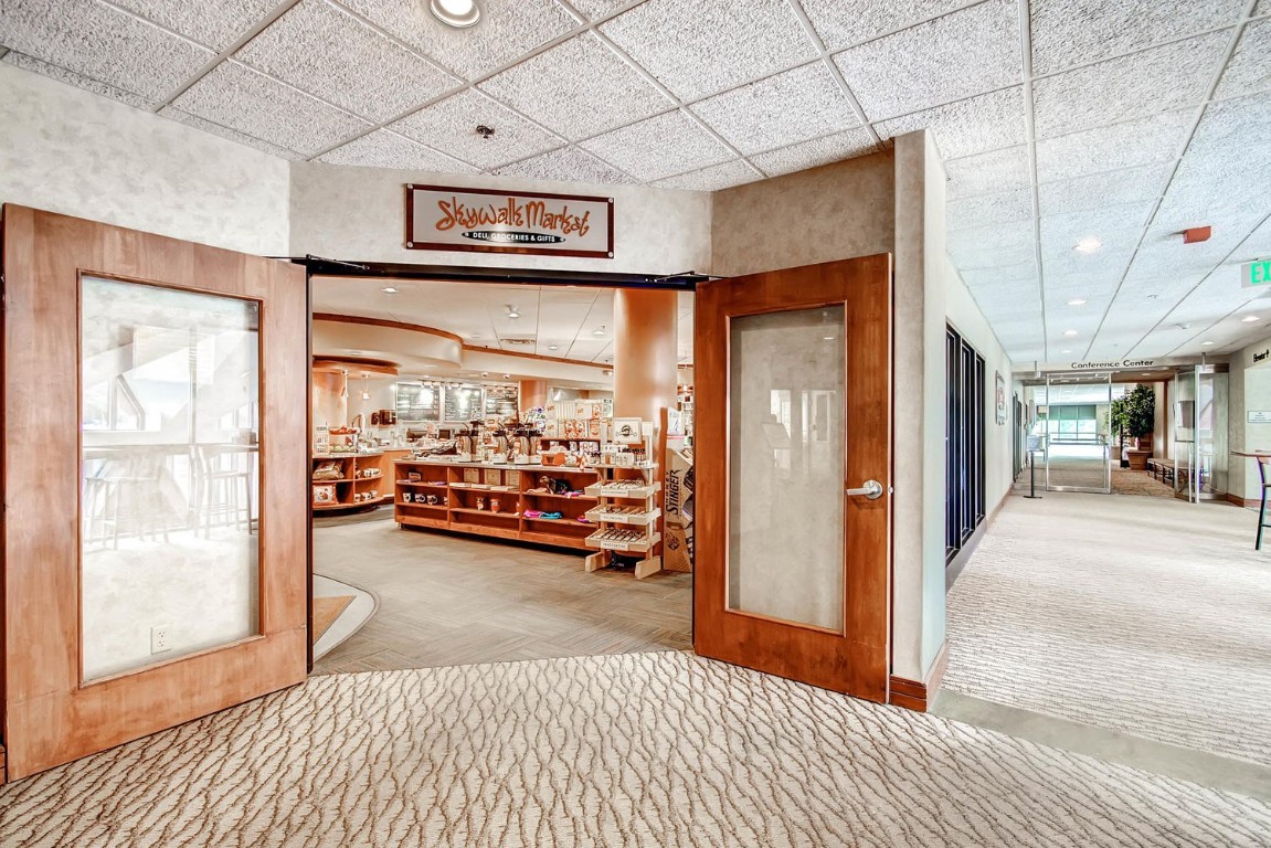 640 Village Road, Unit 4320 Breckenridge, CO 80424 - Photo 29 of 39 a view of a livingroom with furniture and a hallway