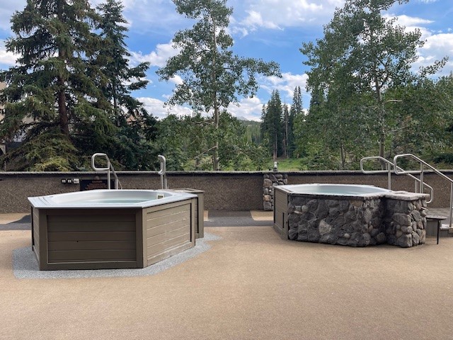 640 Village Road, Unit 4320 Breckenridge, CO 80424 - Photo 33 of 39 a view of a swimming pool with a yard
