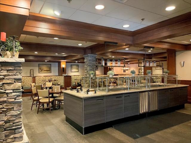 640 Village Road, Unit 4320 Breckenridge, CO 80424 - Photo 38 of 39 a room with lots of wooden furniture