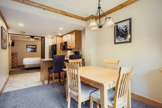 a bedroom with a bed and a night stand