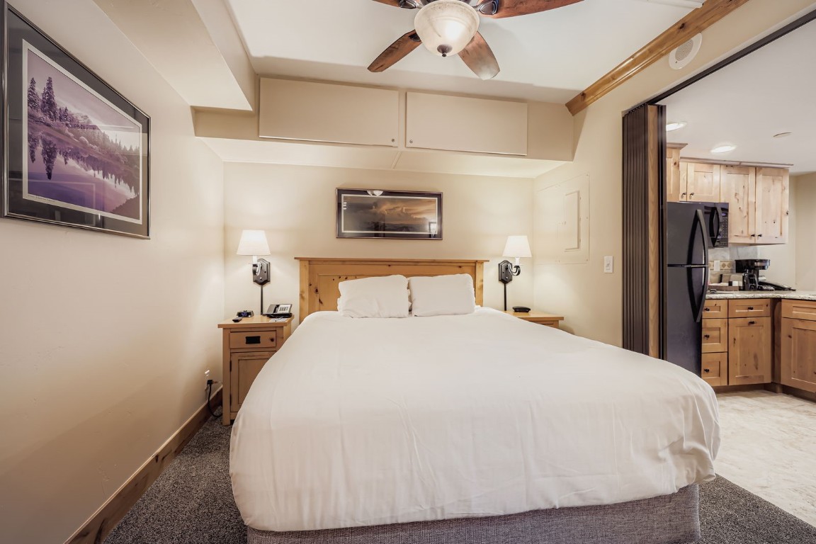 640 Village Road, Unit 4320 Breckenridge, CO 80424 - Photo 8 of 39 a bedroom with a bed and a night stand