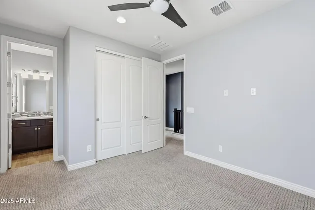 a view of an empty room with a bathroom