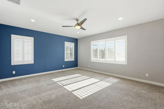 a view of an empty room with windows