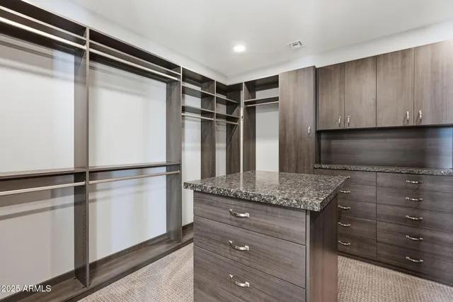 a kitchen with a refrigerator and a sink