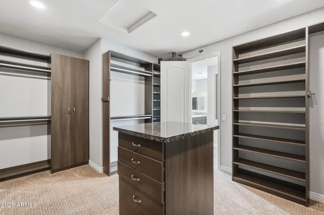 a kitchen with granite countertop cabinets and refrigerator